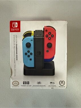 Nintendo Joy-Con Charging Dock with Blue and Red Controllers